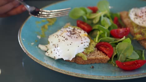 poached egg avocado toast with salad