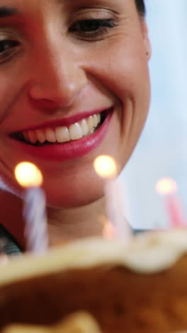 businesswoman looking at birthday cake