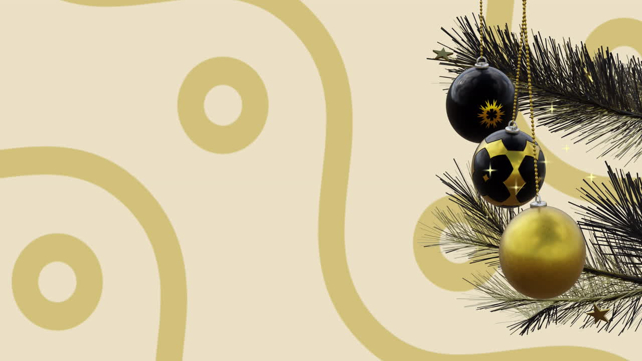 Swinging black and gold christmas baubles over gold curves and ring pattern on beige background