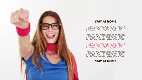 animation of words stay at home pandemic over caucasian woman wearing cape