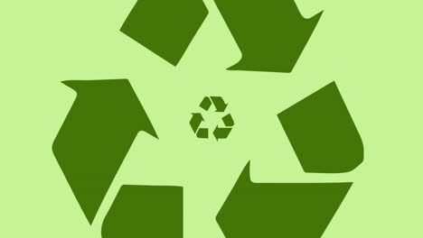 animación del logotipo de reciclaje sobre fondo verde