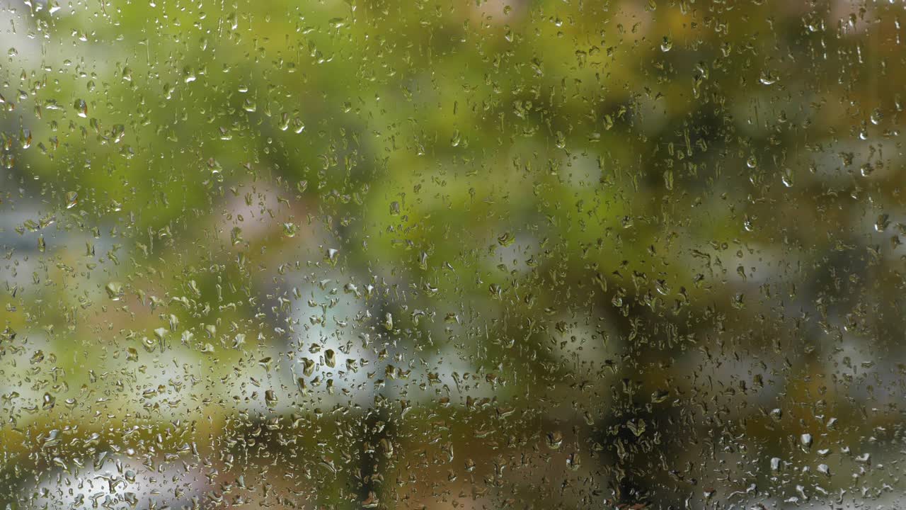 Rain drops on window. Rainy autumn weather. Closeup