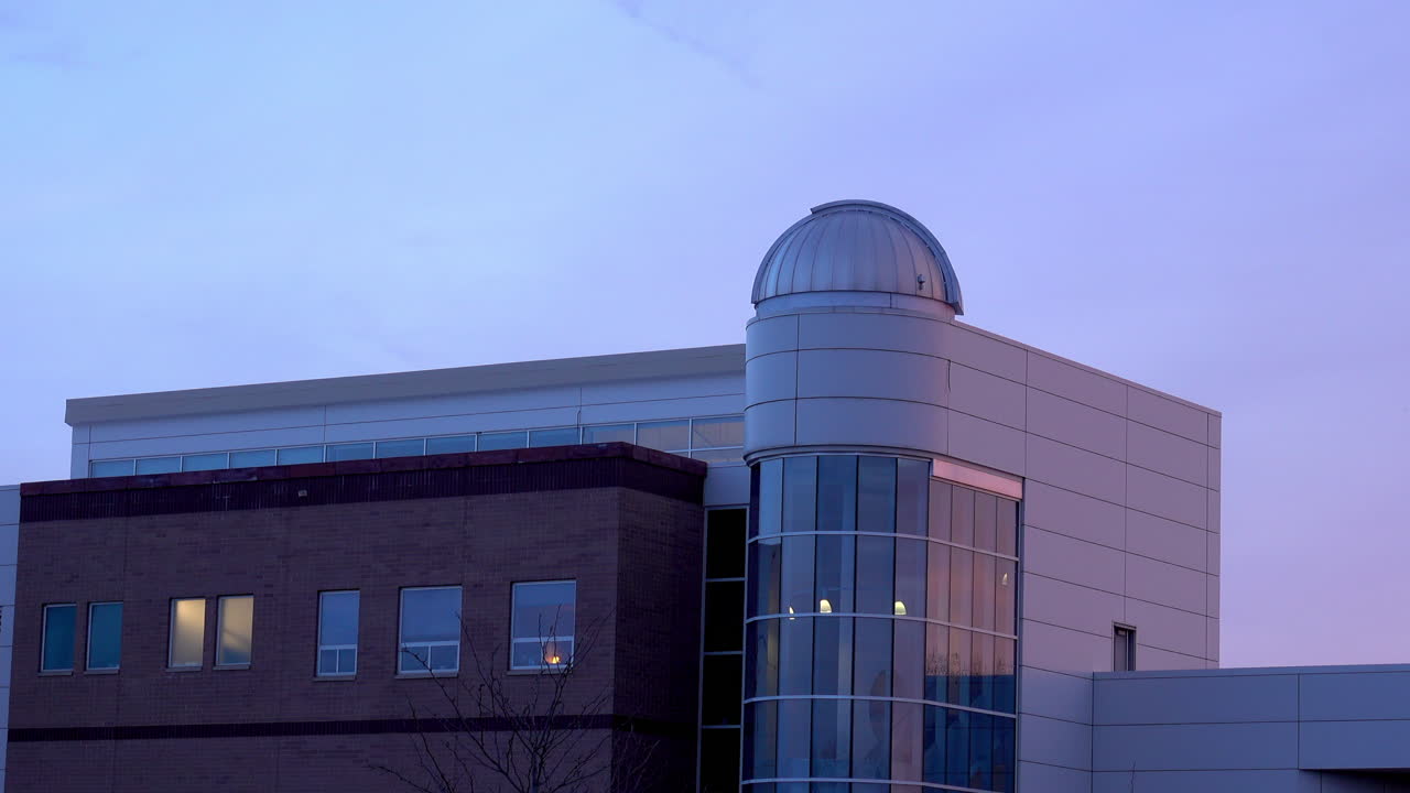 Science building at a college with an observatory dome.