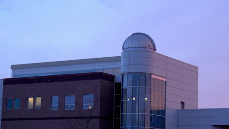 science building at a college with an observatory dome.