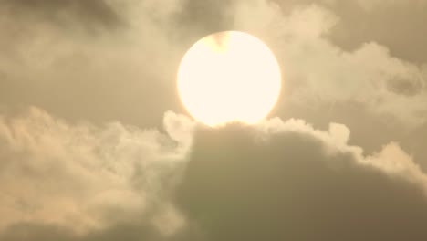 sun orb rising with clouds timelapse