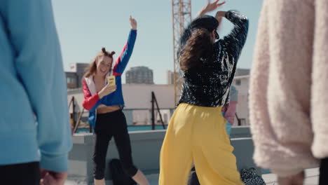 beautiful dancing woman on rooftop having fun dance party with friends enjoying crazy celebration girl performing contemporary dance moves