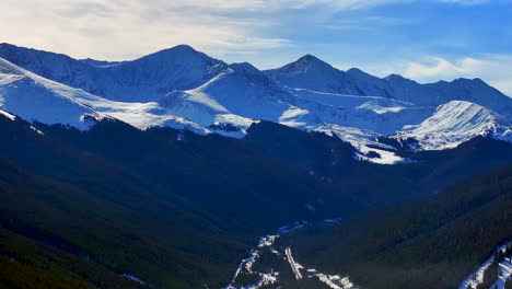 towards leadville copper mountain colorado winter december christmas aerial drone cinematic landscape i70 silverthorne vail aspen ten mile range blue sky clouds rocky mountains forward motion