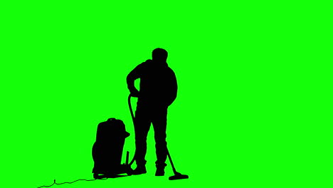 silueta de un hombre que usa una aspiradora frente a una pantalla verde