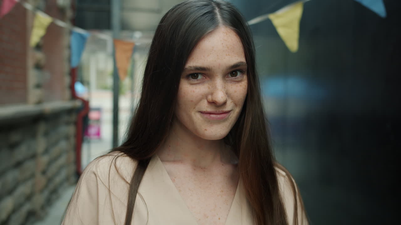 Woman Smiling in City Alley