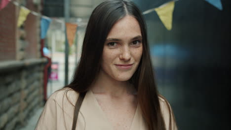 Woman Smiling in City Alley