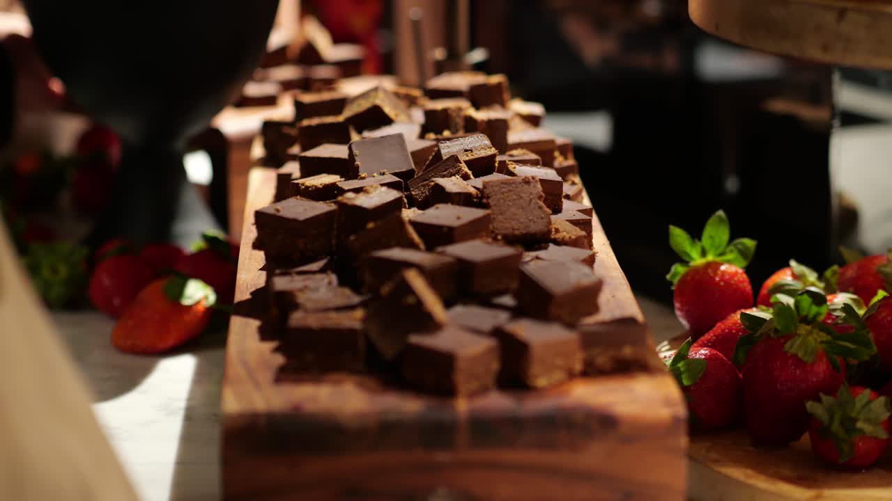 Picking up dark chocolate to eat