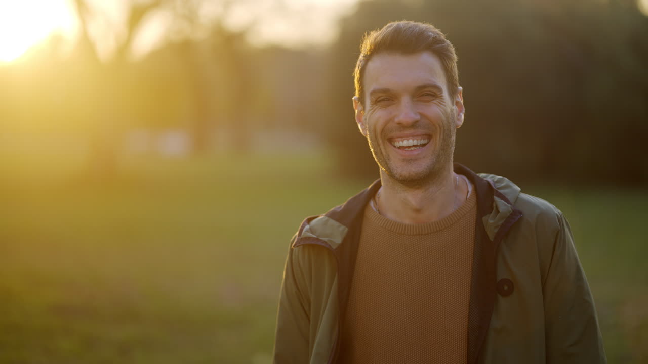 Portrait of a smiling man outdoors in the sunlight