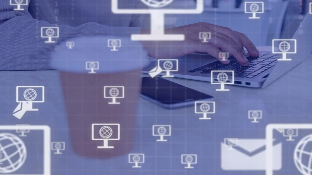 Man working on laptop while pulling from cup, causing floating tech and mail icons over phone