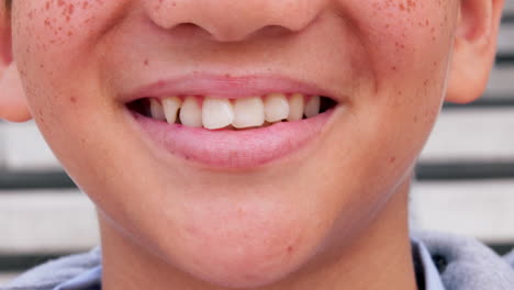 smile, happy and closeup of mouth of boy in city