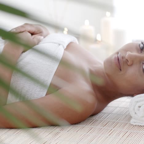 woman lying on a lounger in wellness center