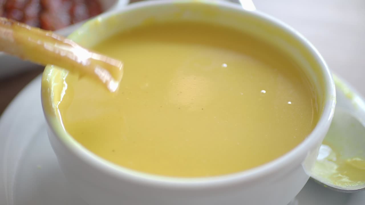 Dipping food in cream soup