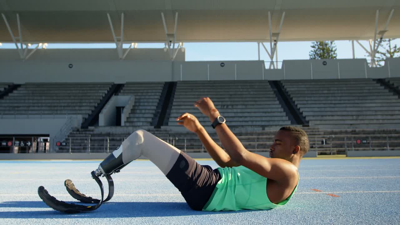 Disabled athletic exercising on a running track 4k
