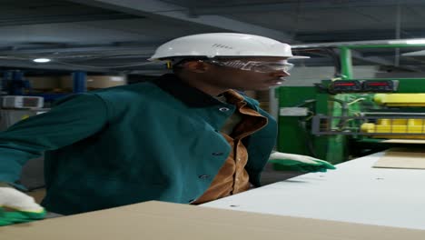 factory worker handling cardboard boxes