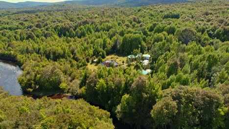 aerial orbit of the lodge in tepuhueico park, forest zone, greenery in chiloé, chile