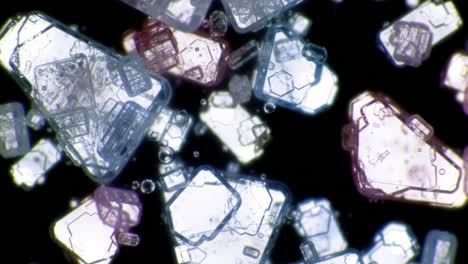 intricate microstructures of crystalline particles captured under magnification, revealing their unique shapes and interactions in a stunning display of natural beauty
