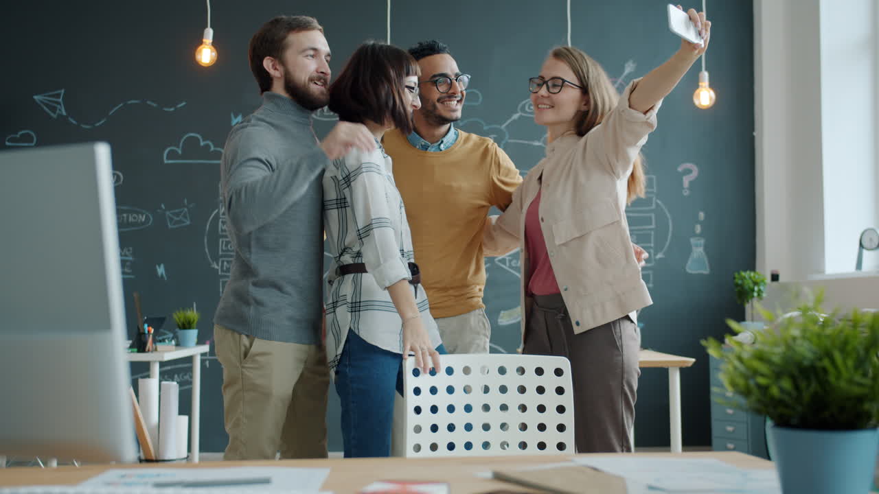 Happy Team Taking a Selfie in the Office