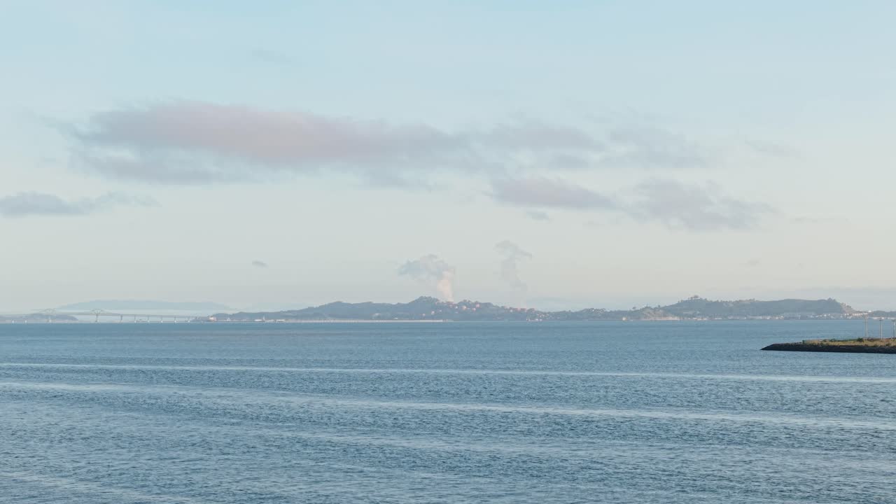 A rotating aerial view of the ocean surrounding Treasure Island.