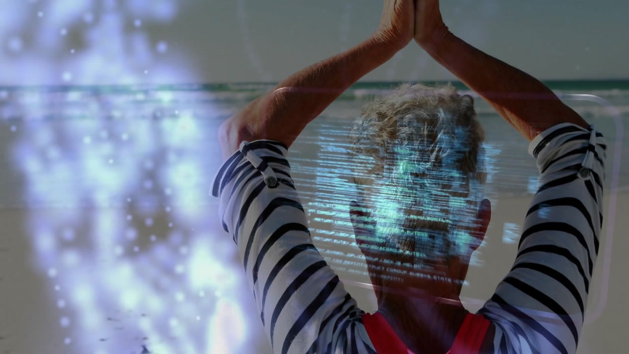 Senior woman praying at beach starting health holographic data streams wrapping before fading torso