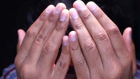 close up of muslim man hand praying at night