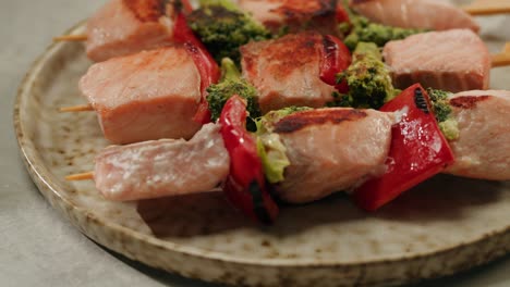 grilled salmon skewers with broccoli and bell peppers