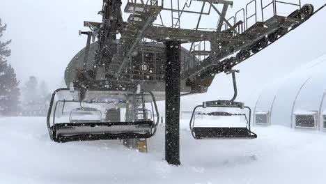 empty ski lifts in a blizzard snow storm in mammoth, sierras