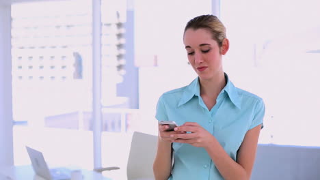 stylish content businesswoman texting