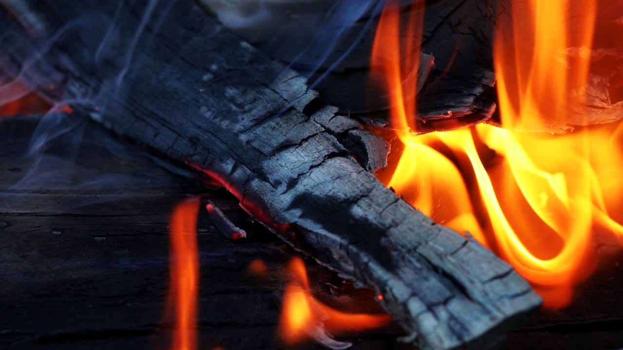 Burning fire. In the fire burn wood chips trees. Campfire camp fire summer burning fire.