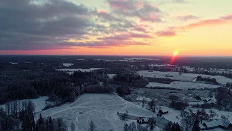 beautiful drone shot of snow covered nature landscape at sunset