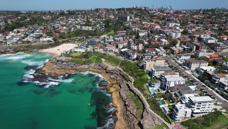 tamarama beach and tamarama point at daytime in nsw, australia - aerial drone shot