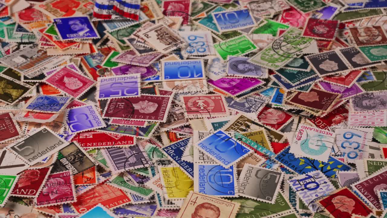 Collection of colorful stamps from various places on a table
