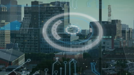 animation of graphs, circles and power supply over aerial view of modern city against sky