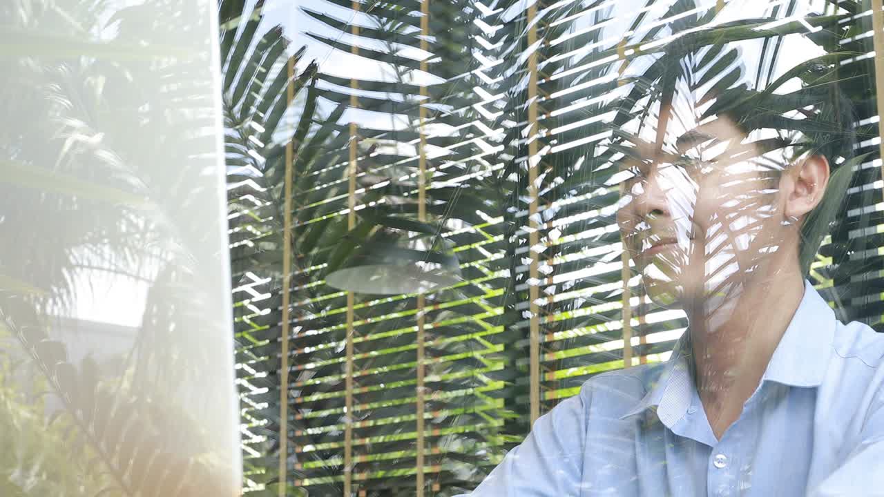 close up smiling asian businessman working in loft office