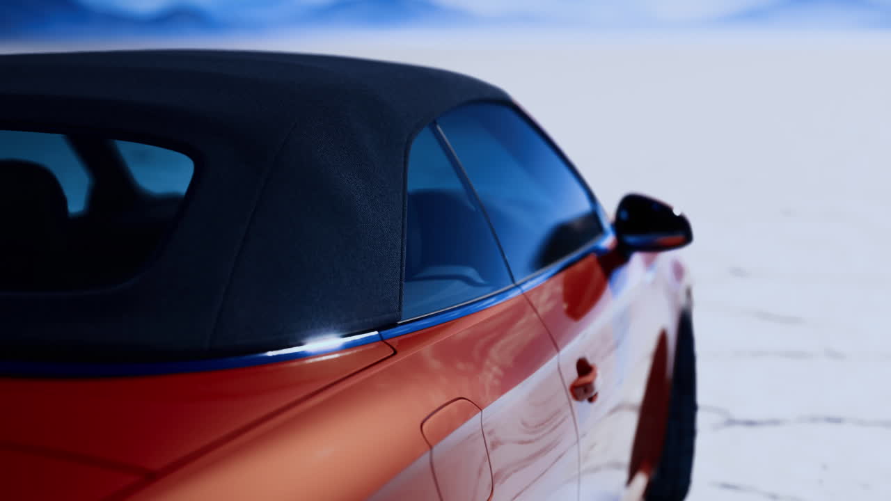 Luxury convertible parked in a vast desert landscape during sunset