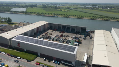 aerial of recycling plant with solar panels on rooftop