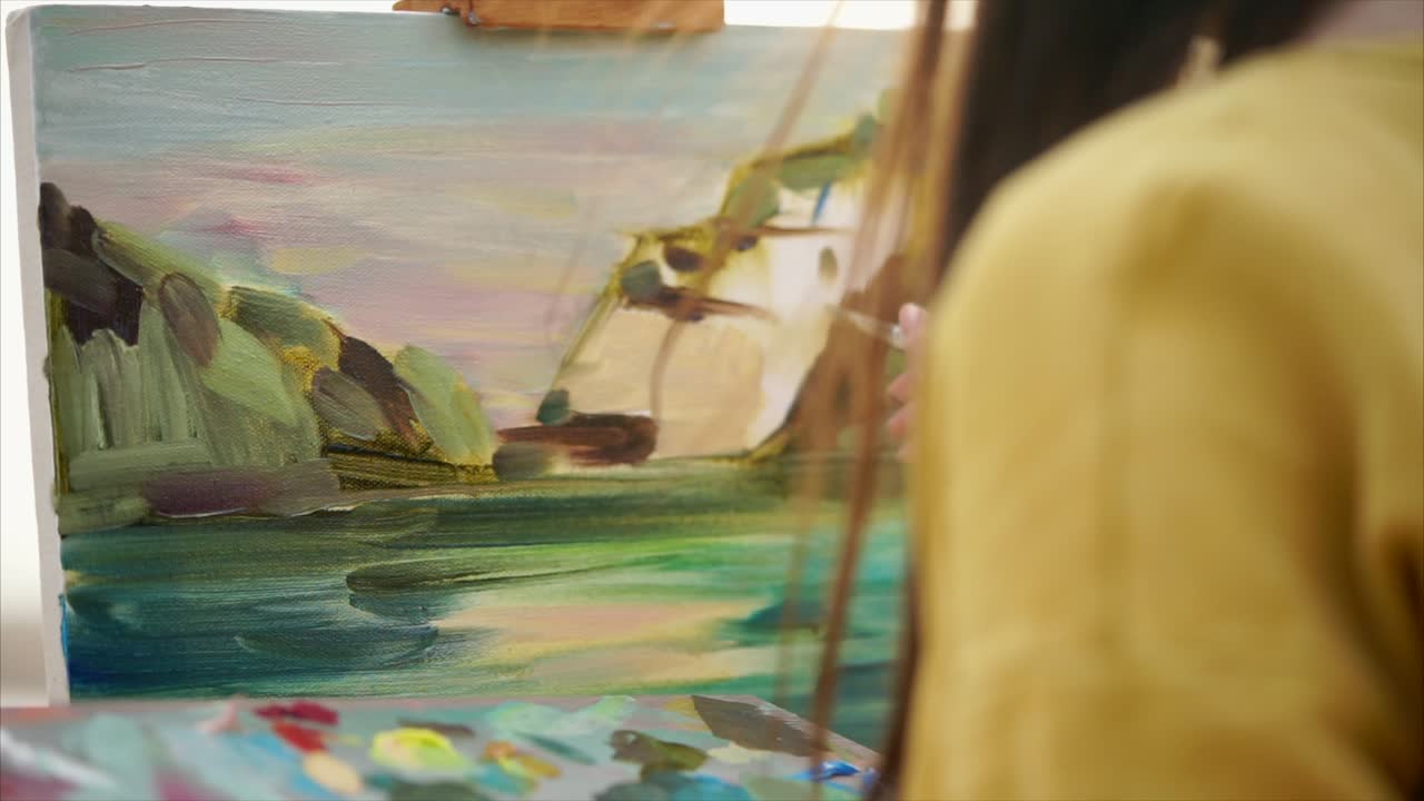 Woman painting a landscape oil painting