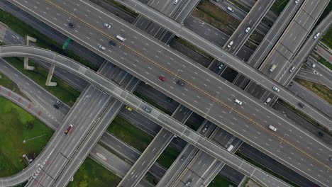 high angle looking top down view of complicate road and expressway intersection in bangkok city of thailand. shot by drone can use for transportation or abstract concept.