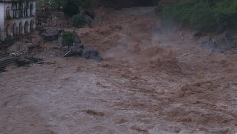 drone shot captures massive flooding of bagmati river in kathmandu, nepal, as monsoon rains and a cloudburst destroy urban areas and riverbanks urgent need for help amid the ongoing climate crisis