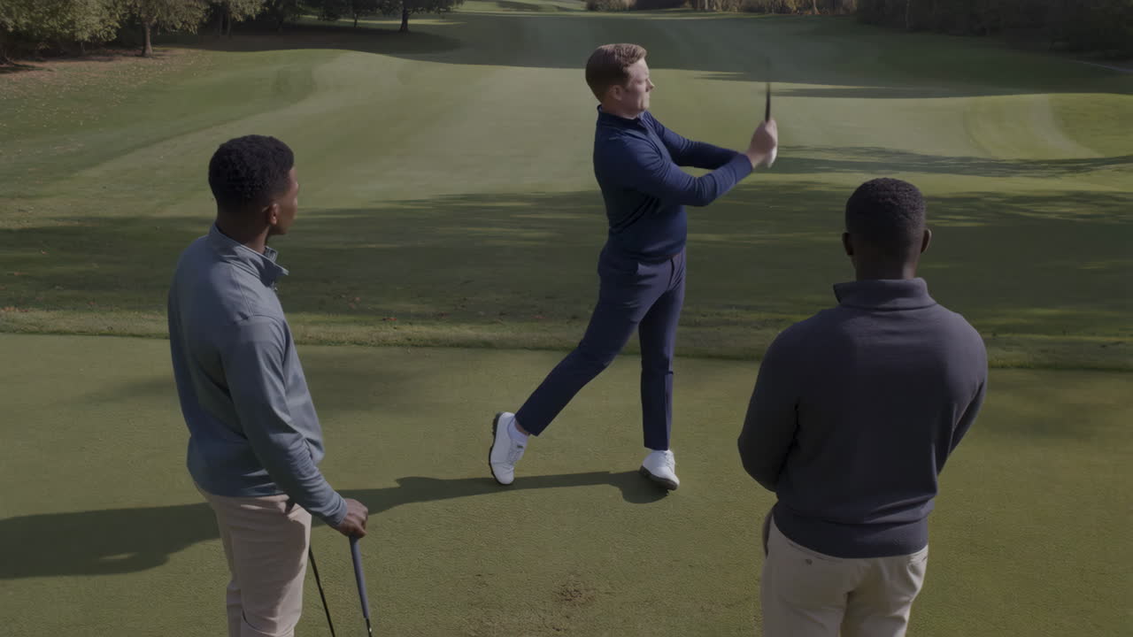 Men playing golf on a sunny day
