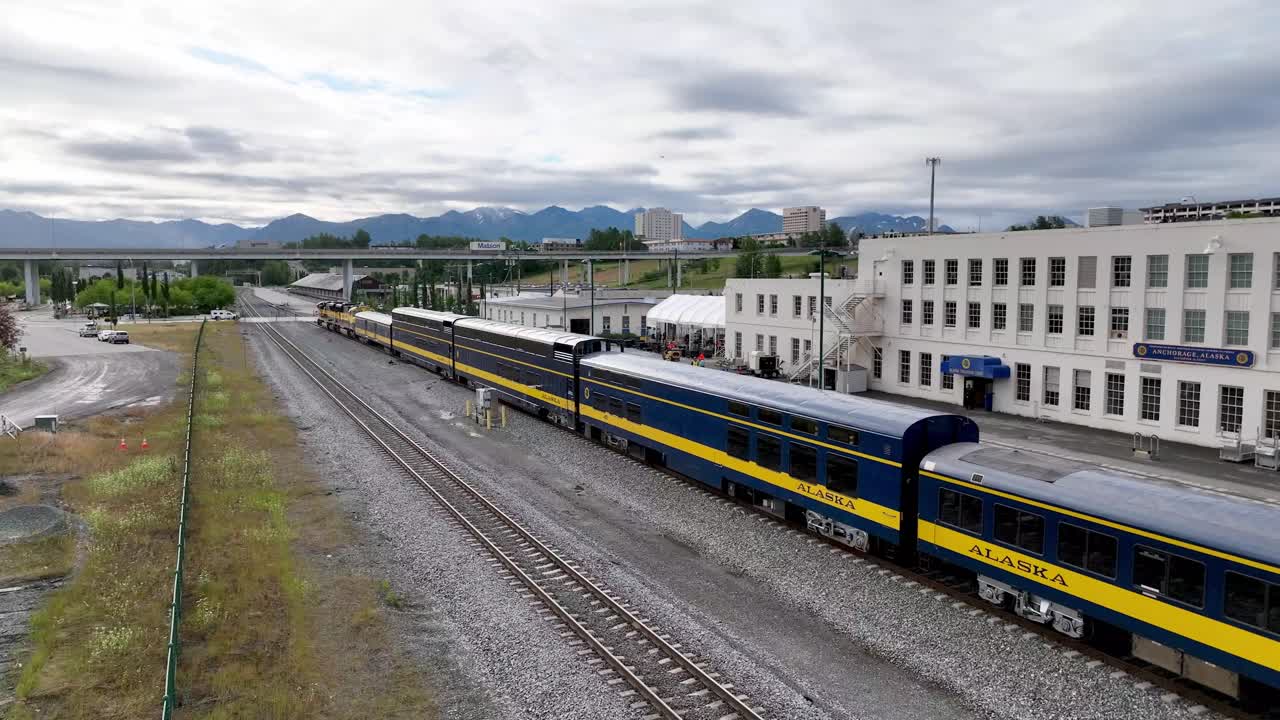Alaska Railroad Train at Anchorage Station with Mountains