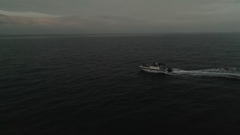 lonely boat in the pacific ocean view from a drone