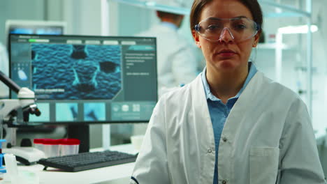 close up of scientist nurse looking tired at camera