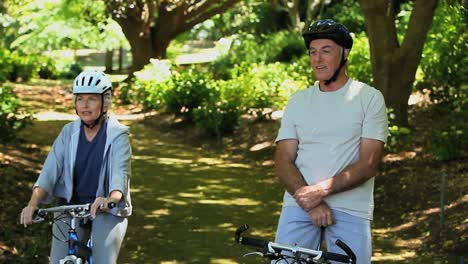 Old-man-and-woman-on-bikes-looking-at-the-way-ahead