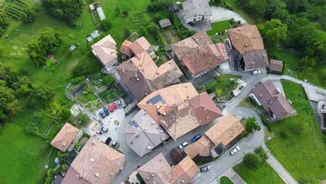 aerial top down view of a small historic town in the italian alps