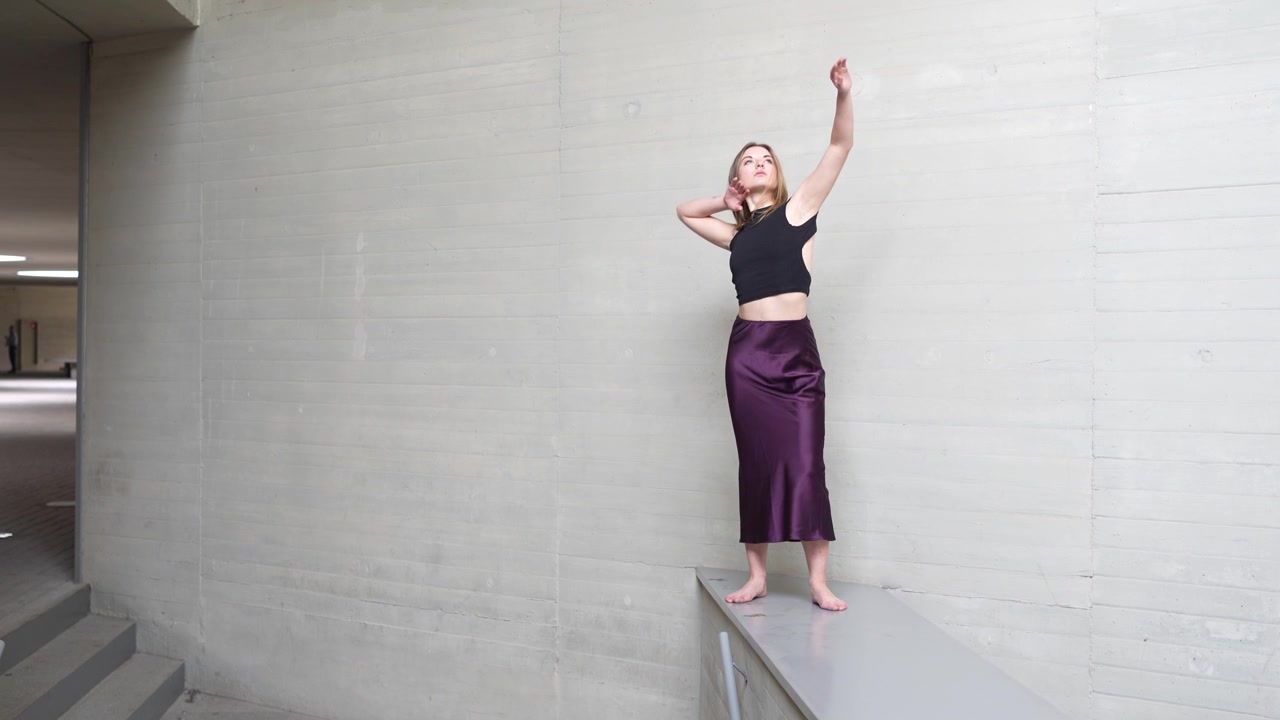 An artistic dance performance taking place on an elevated surface for spectators to enjoy