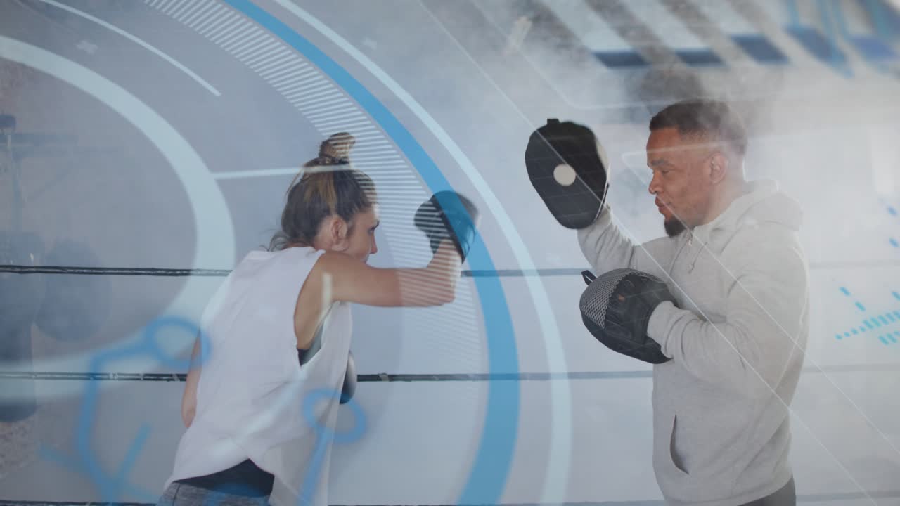 Woman boxing trainee moving throwing jabs then punch after coach holding mitts HUD aiding training